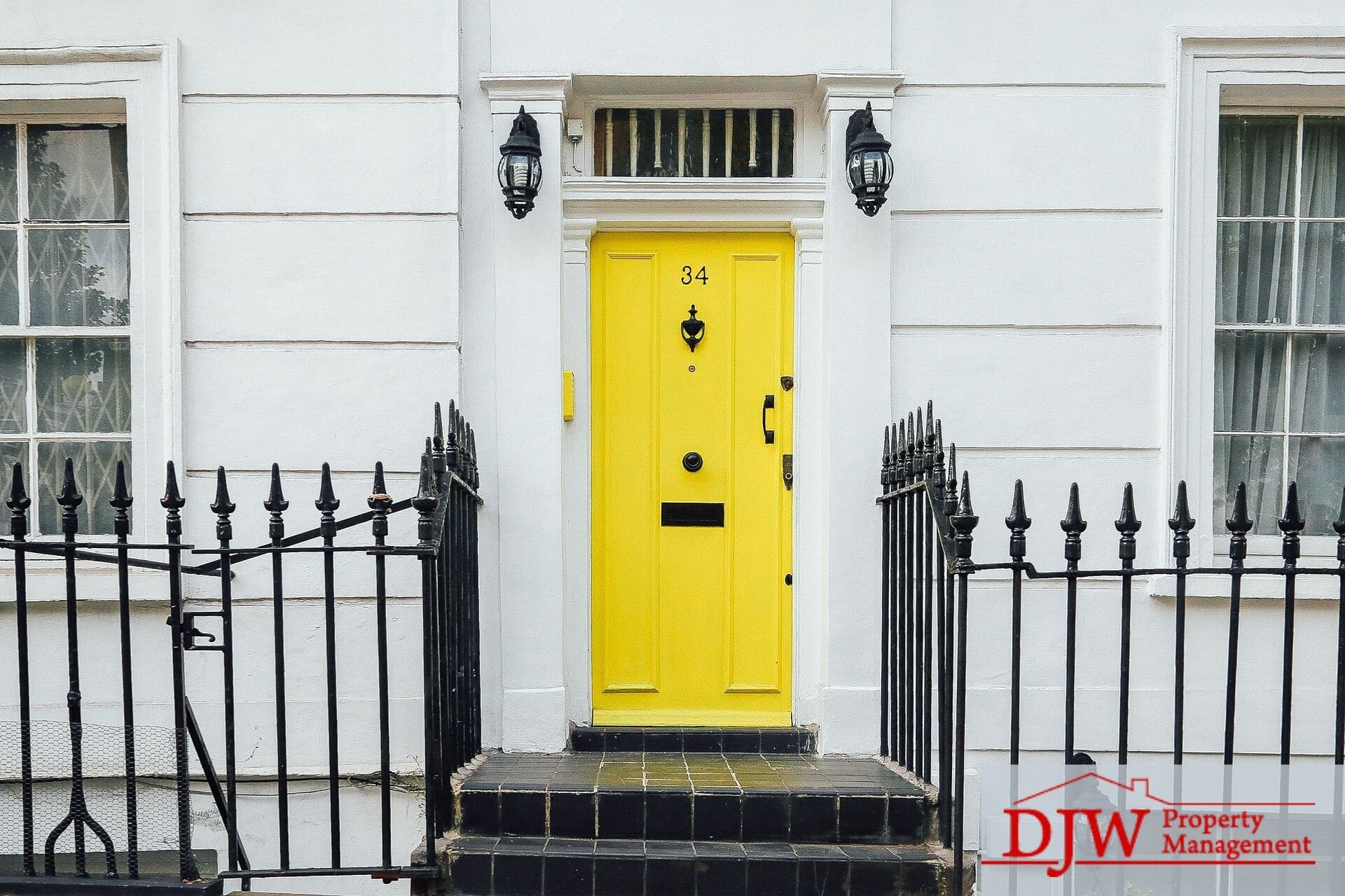 An entrance to an apartment with a yellow door