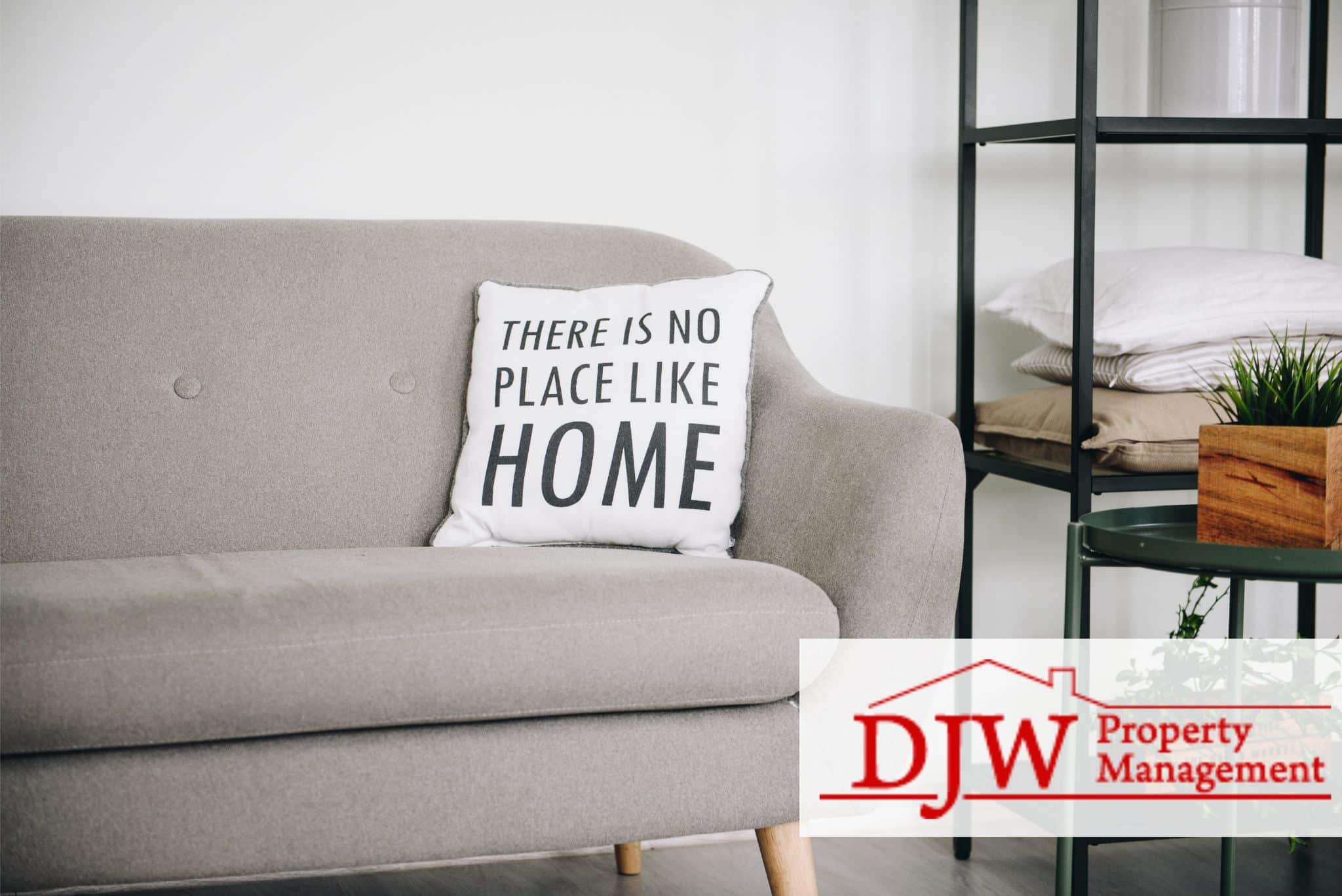 Gray couch with a throw pillow in the living room.